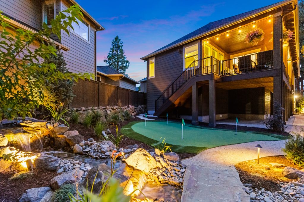 NW Bend backyard pondless water feature pathway with lighting — Bend, OR